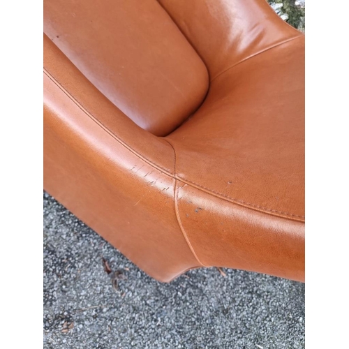 1651 - A modern leatherette chair and stool, (surface wear).