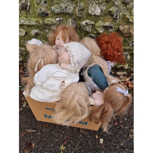 1654 - Dolls: a group of nine modern dolls, six with porcelain heads, hands and lower legs, with soft bodie... 