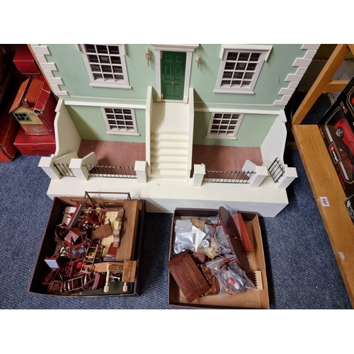 103 - Doll's House: a large wooden 4 storey doll's house; together with a collection of associated furnitu... 