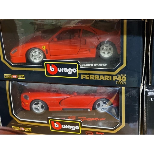 107 - Burago: four boxed models, comprising two Ferraris and two Dodge Viper examples.... 