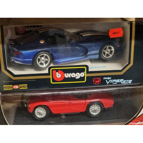 107 - Burago: four boxed models, comprising two Ferraris and two Dodge Viper examples.... 