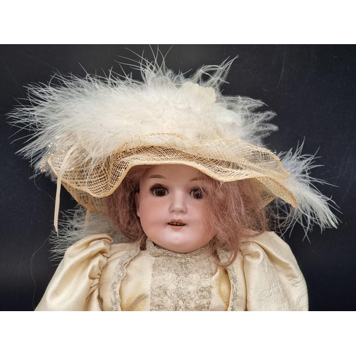 108 - Armand Marseille: an antique bisque head doll, impressed mark 370 AM 1 DEP, with brown weighted eyes... 