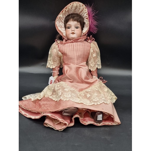 109 - Armand Marseille: an antique bisque head doll, impressed mark 370 AM-4 DEP, with brown weighted eyes... 