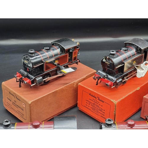 119 - Hornby O Gauge: a group of 6 vintage locomotives (3 boxed); together with 8 carriages.... 