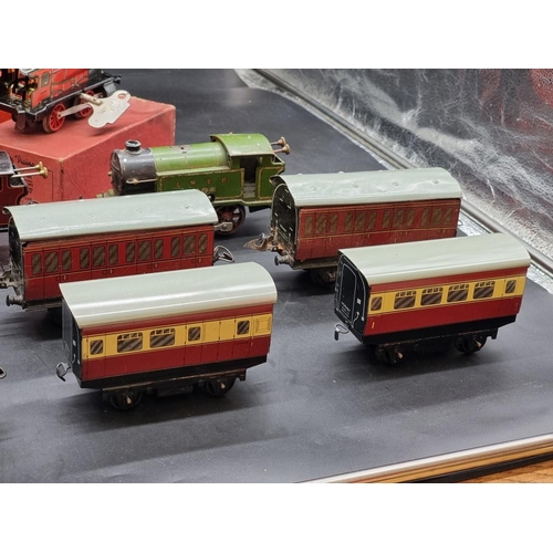 119 - Hornby O Gauge: a group of 6 vintage locomotives (3 boxed); together with 8 carriages.... 