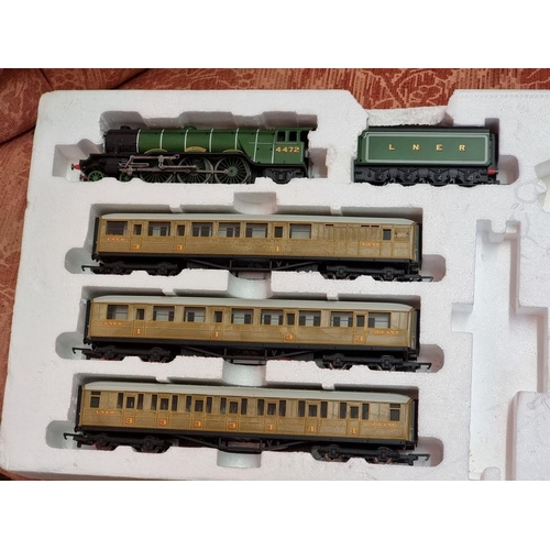 127 - Piko: a boxed train set H0 57110; together with an incomplete Hornby OO Flying Scotsman R1072.... 