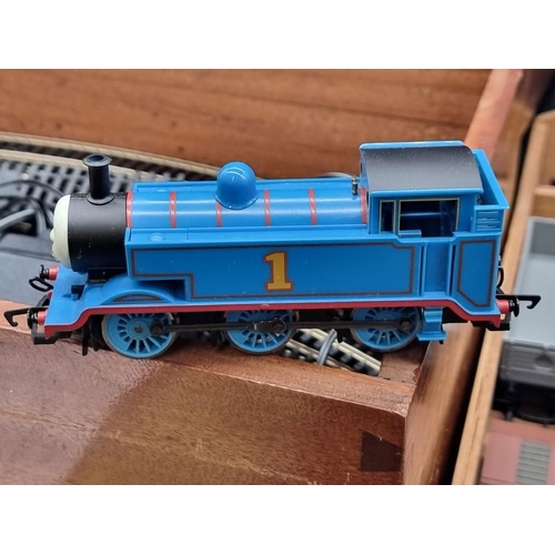 128 - Hornby OO Gauge: a trainset, in wooden box, to include an additional 'Thomas' locomotive.... 