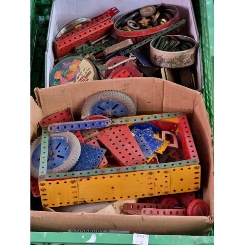 132 - Meccano: a large collection in 4 boxes of vintage Meccano, to include 15 related instruction bo... 