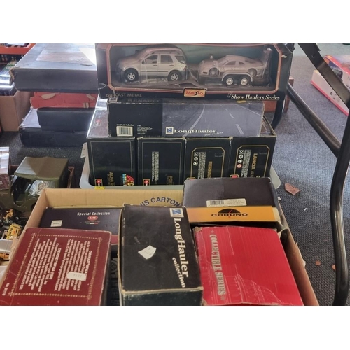 140 - Two boxes of vehicles, to include examples by Burago; Maisto and Chrono, all boxed.... 