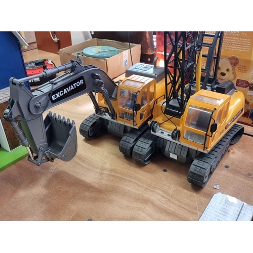 143 - Hobby Engine: Excavator and Crawler Crane, both battery operated remote controlled, with controllers... 