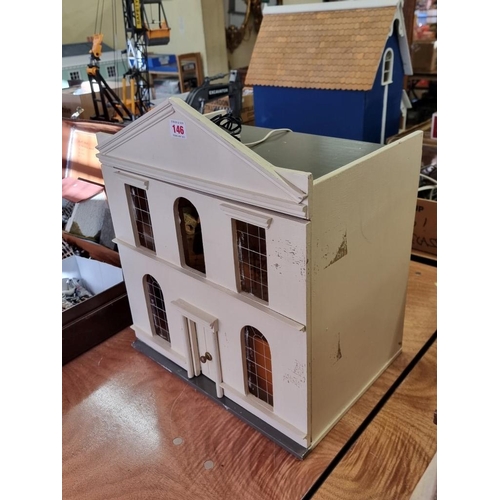 146 - Doll's House: a wooden doll house, approx 45cm high x 40cm wide; together with a quantity of do... 