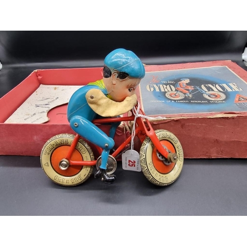 25 - Triang: a vintage tinplate Gyro-Cycle , in original box, (distressed).