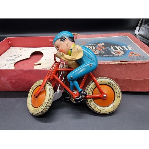 25 - Triang: a vintage tinplate Gyro-Cycle , in original box, (distressed).