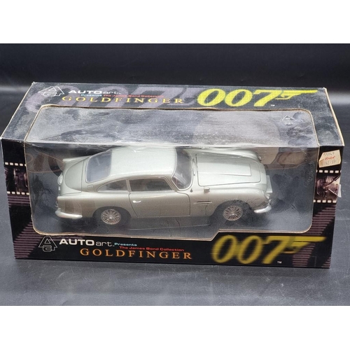 31 - Autoart: The James Bond Collection, Goldfinger DB5; together with a Burago Lamborghini Murcielago, b... 