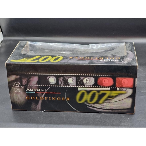 31 - Autoart: The James Bond Collection, Goldfinger DB5; together with a Burago Lamborghini Murcielago, b... 