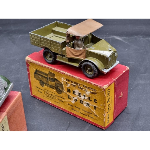 41 - Britains: three vintage military vehicles, comprising: Army Lorry No.1334 (x2); a Beetle Lorry No.18... 