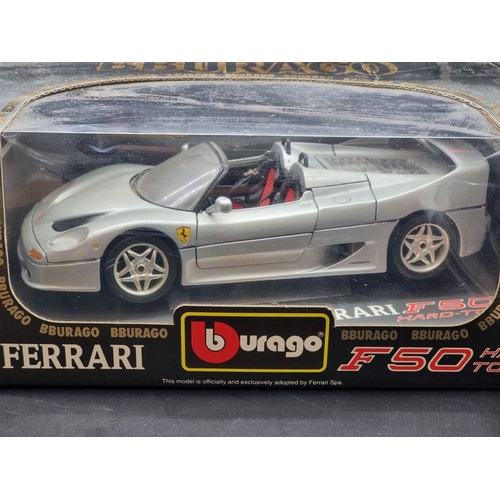 44 - Burago: a black Ferrari F50 Limited Edition; together with another F50, both boxed.