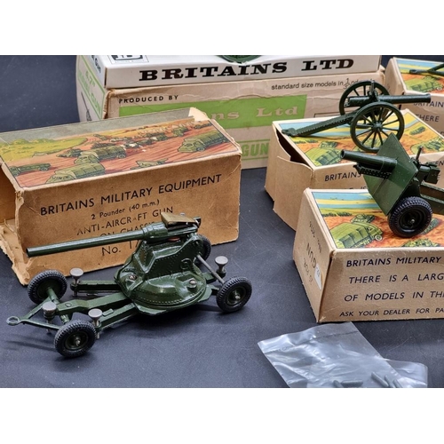 48 - Britains: 9 military vehicles and guns, circa 1960s, all in original boxes.