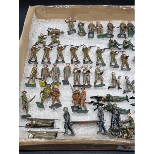 61 - Vintage Lead: a collection of Britains and similar soldiers, to include motorcyclists, stretchers an... 