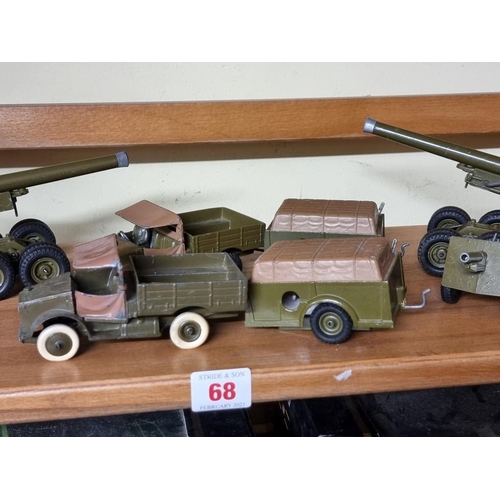 68 - Britains: a small group of vintage military vehicles and guns. (9)