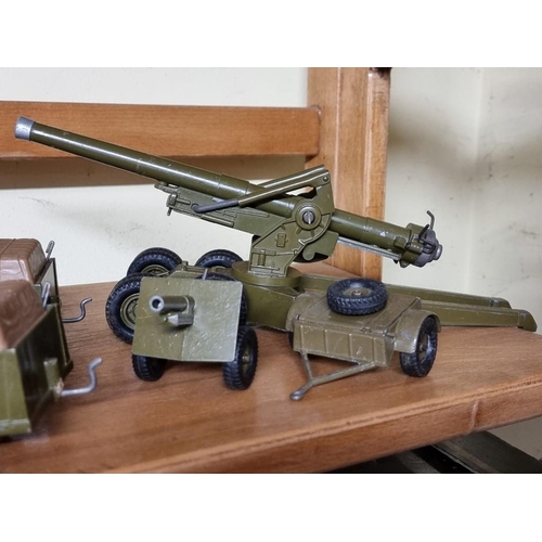 68 - Britains: a small group of vintage military vehicles and guns. (9)