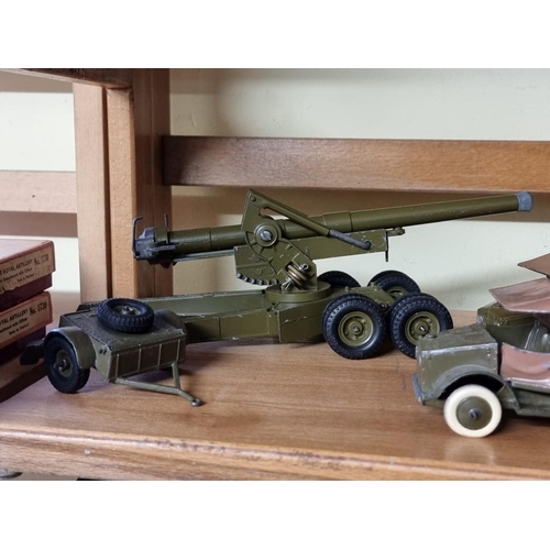 68 - Britains: a small group of vintage military vehicles and guns. (9)