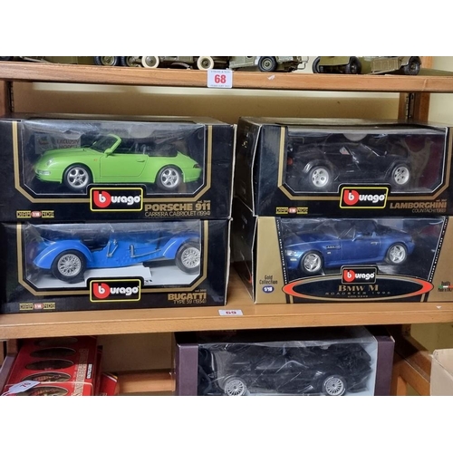 69 - Burago: four boxed Burago cars. to include a green Porsche 911.