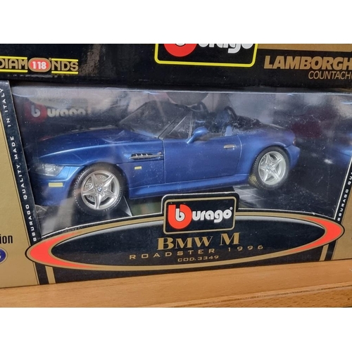 69 - Burago: four boxed Burago cars. to include a green Porsche 911.