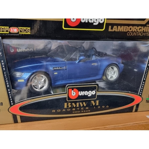 69 - Burago: four boxed Burago cars. to include a green Porsche 911.