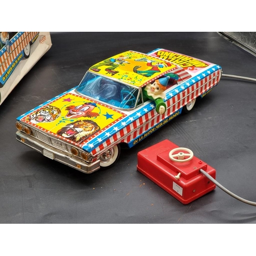 74 - Rico: a vintage tinplate battery operated remote controlled 'Circo Americano' large scale car, ... 