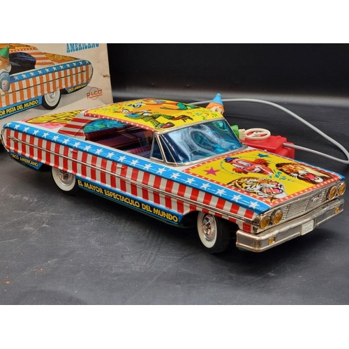 74 - Rico: a vintage tinplate battery operated remote controlled 'Circo Americano' large scale car, ... 