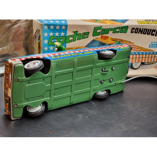 74 - Rico: a vintage tinplate battery operated remote controlled 'Circo Americano' large scale car, ... 