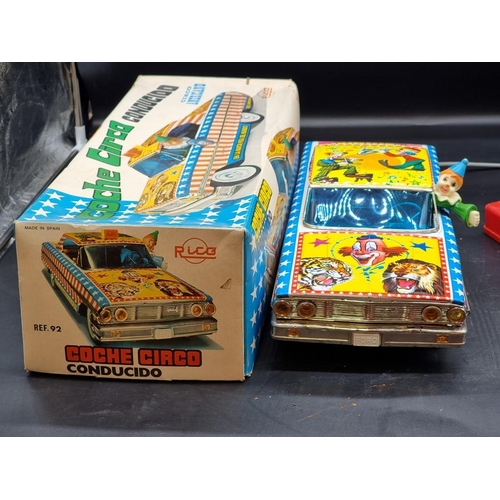 74 - Rico: a vintage tinplate battery operated remote controlled 'Circo Americano' large scale car, ... 