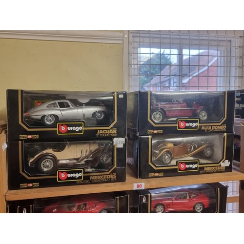 80 - Burago: four boxed models, to include a silver E Type.