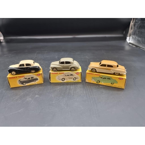 83 - Dinky: three vintage boxed vehicles, comprising: Morris Oxford Saloon No.159; Studebaker Land C... 