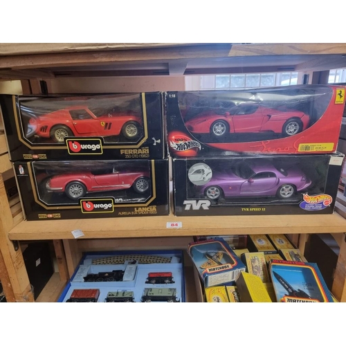 84 - Burago: four boxed models, to include Hot Wheels Ferrari and TVR.