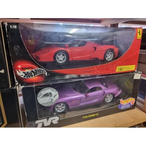 84 - Burago: four boxed models, to include Hot Wheels Ferrari and TVR.