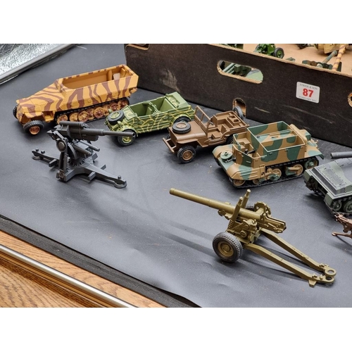 87 - Dinky: a collection of Dinky military vehicles and artillery.