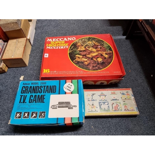 88 - Meccano:  a Super Highway Multikit; together with a vintage Grandstand TV game; and another gam... 