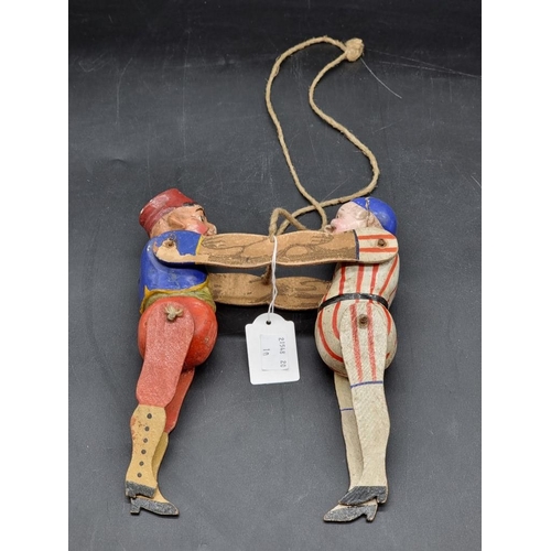 9 - A vintage wooden and papier mache puppet of two joined figures, 22cm high.... 