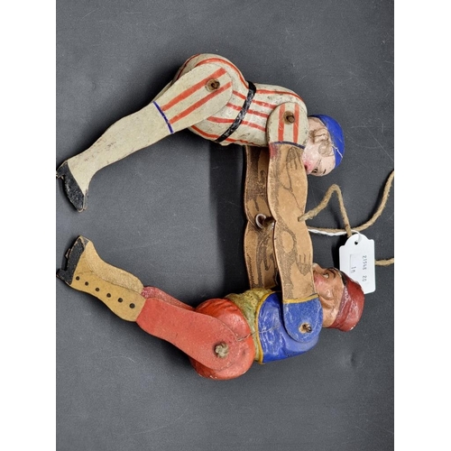 9 - A vintage wooden and papier mache puppet of two joined figures, 22cm high.... 