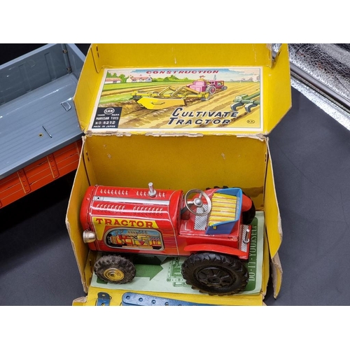 92 - Tinplate: a vintage Japanese Marusan Tractor construction kit in box (1950s); together with a T... 