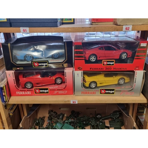 93 - Burago: four boxed models, to include: a light blue Limited Edition Porsche 911 No.3060; and a ... 