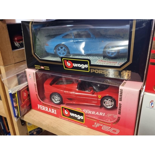 93 - Burago: four boxed models, to include: a light blue Limited Edition Porsche 911 No.3060; and a ... 