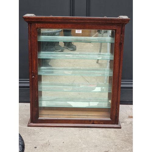 1037 - An early 20th century mahogany hanging display cabinet, with mirrored back, 76cm high x 67.5cm wide ... 