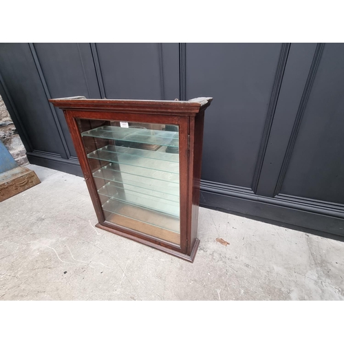 1037 - An early 20th century mahogany hanging display cabinet, with mirrored back, 76cm high x 67.5cm wide ... 