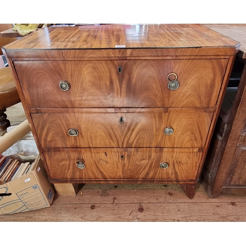 1095 - A late 18th century Continental mahogany three drawer chest, possibly Biedermeier, 76.5cm wide.... 