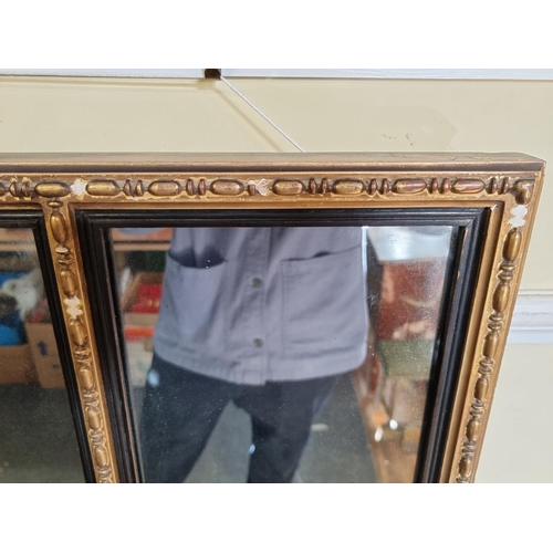 1114 - An antique giltwood framed overmantel wall mirror, 48.5 x 112cm.