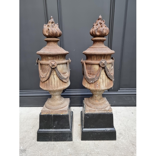 1208 - A pair of Neo-Classical style cast iron gate pier finials, 64cm high, (one lacking swag).... 