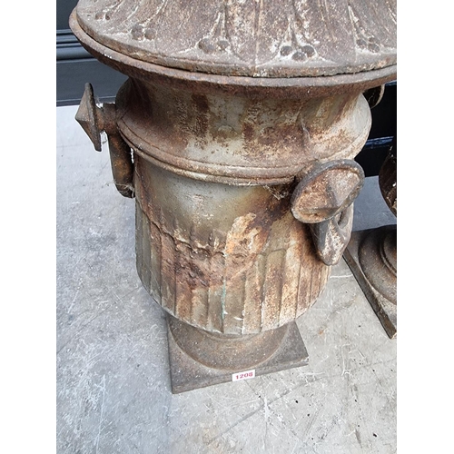 1208 - A pair of Neo-Classical style cast iron gate pier finials, 64cm high, (one lacking swag).... 